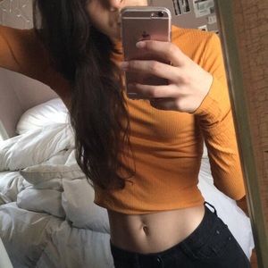 Orange turtleneck crop top